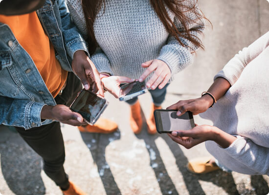 People looking at phones
