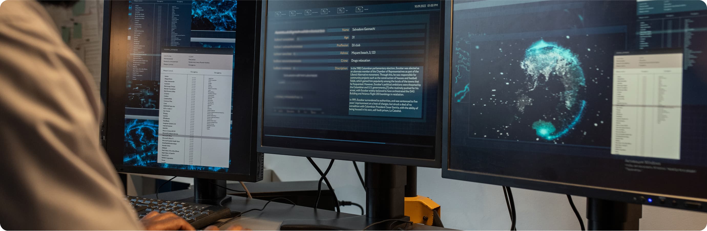 Sex Offender Tracking man behind a computer looking over data